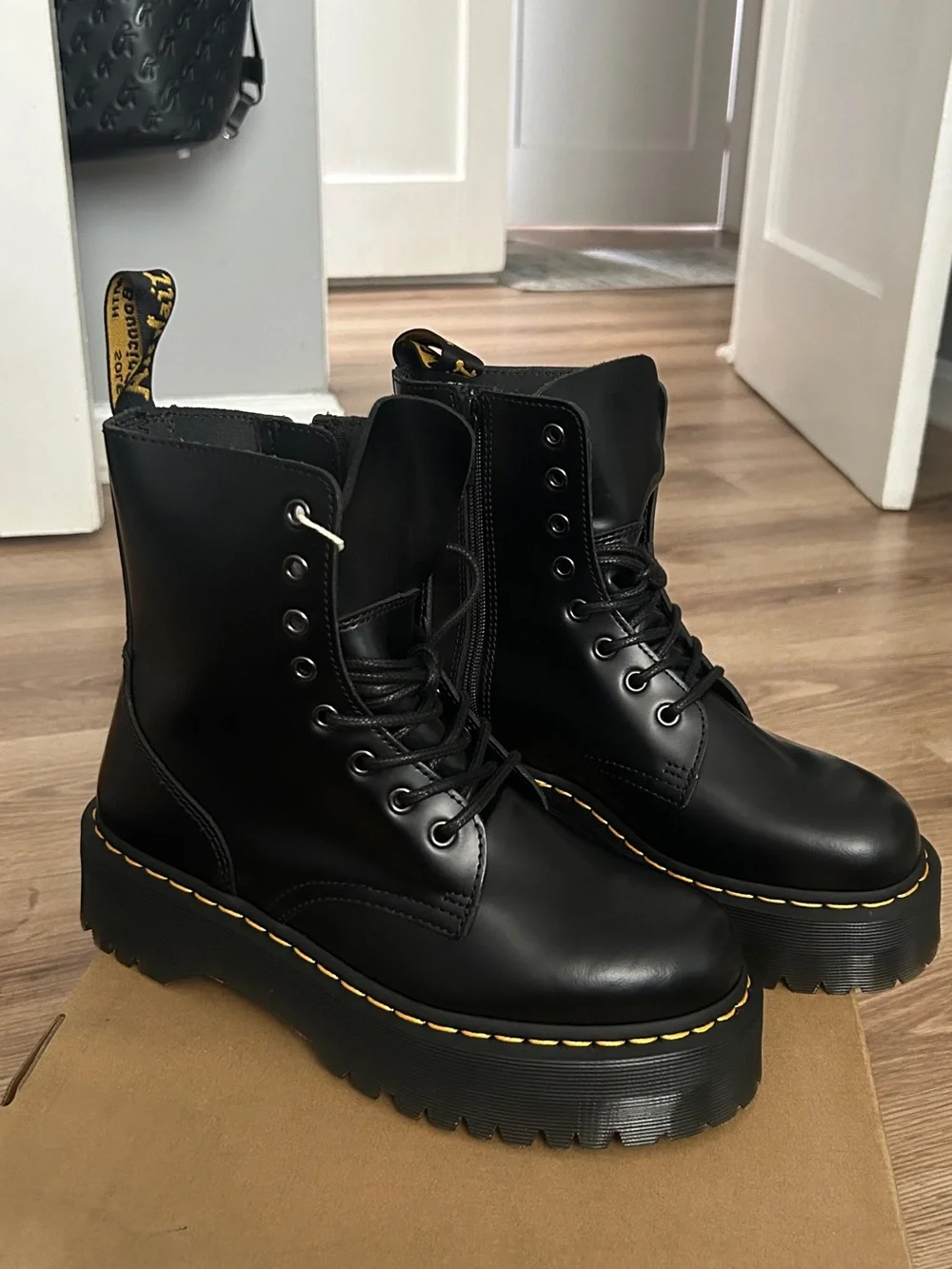 Dr. Martens Black Leather Platform Lace-Up Boots with Yellow Stitching